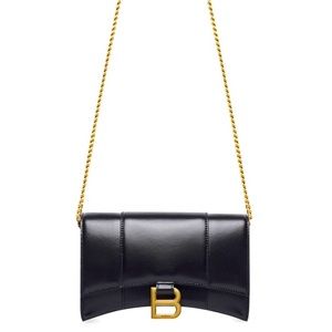 Balenciaga hourglass bag with gold chain.